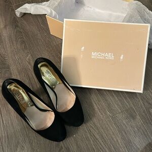 Michael Kors Black suede heels with a gold accent.